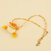 Forest Sprite Spirit Pendant - Orange and Green – side view showing shape and hand-stitched details