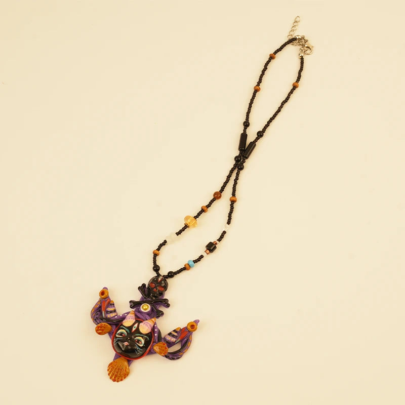 Night Guardian Spirit Pendant - Purple Bat – side view showing shape and hand-stitched details