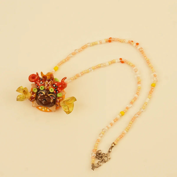 Red Doll Face Pendant — Golden Crown Spirit
