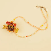 Golden Crown Spirit Pendant - Red Doll Face – side view showing shape and hand-stitched details