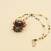 Flame Spirit Pendant - Orange Fire Dancer – side view showing shape and hand-stitched details