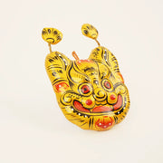 Golden Tiger Spirit Mask - Hand-Embroidered Wall Guardian – close-up of linen, patchwork, and textile texture