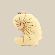 Handcrafted Linen Ivory Nautilus Shell Bag Charm – handmade linen animal bag charm by Brusion
