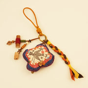 Mythical Bird Bag Charm - Blue Sky Guardian – close-up of linen, patchwork, and textile texture