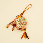 신화 속 물고기 가방 참 - 황금 헤엄꾼 – side view showing shape and hand-stitched details